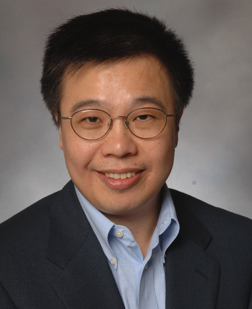 Professional photo of Qimiao Si in front of grey background