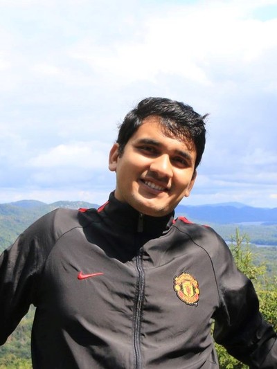 Photo of Aashwin Basnet with mountains in background