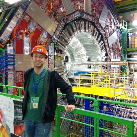 Photo of Dr. Brent Yates in front of large machinery