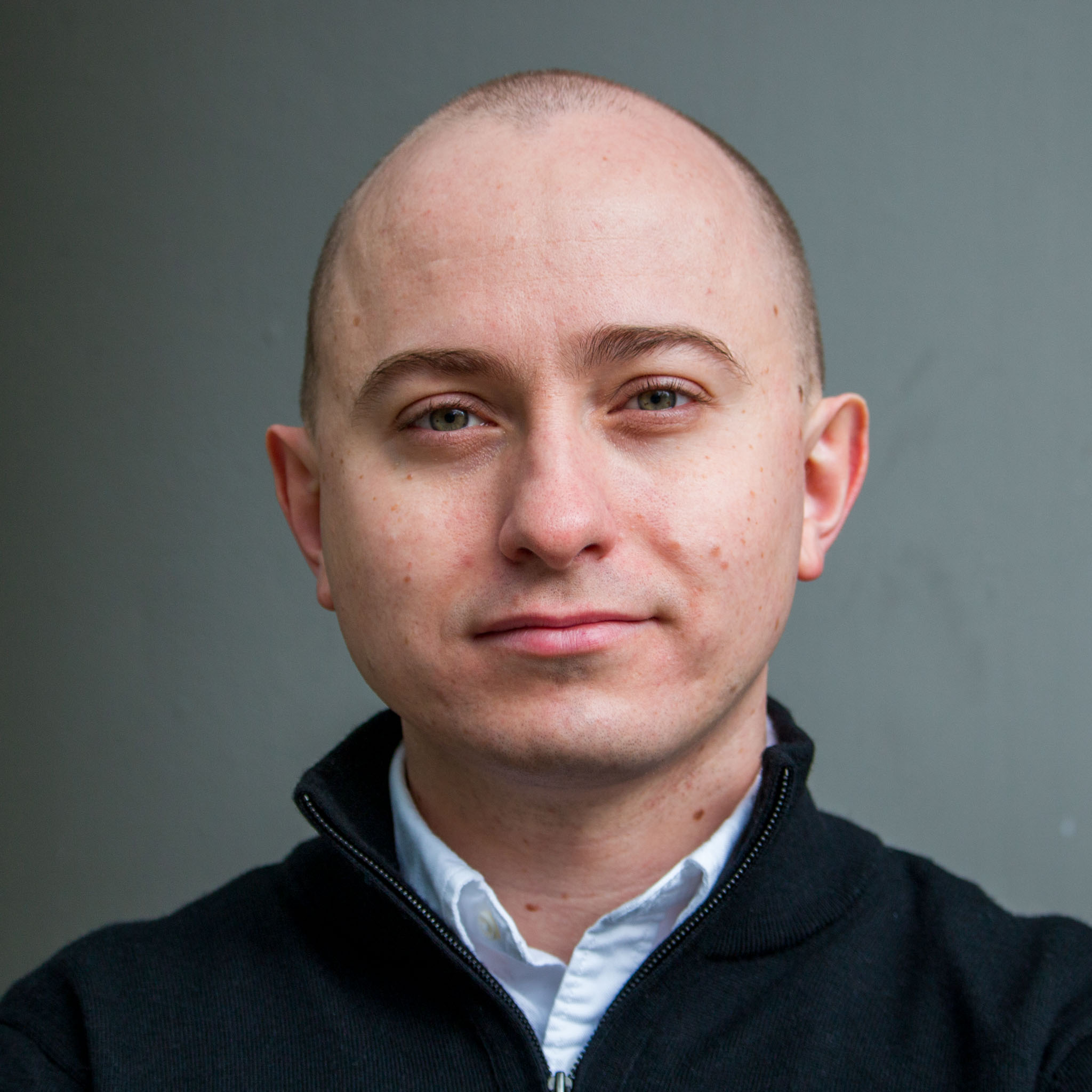 Headshot of Dmitry Ovchinnikov with grey background