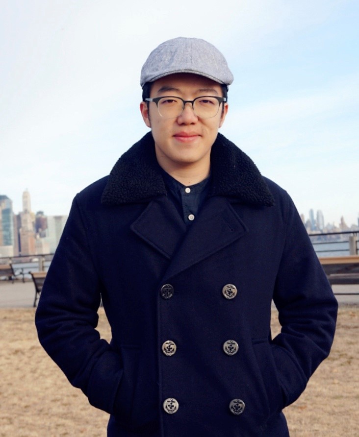 Photo of Shaowen Chen with city skyline in the background