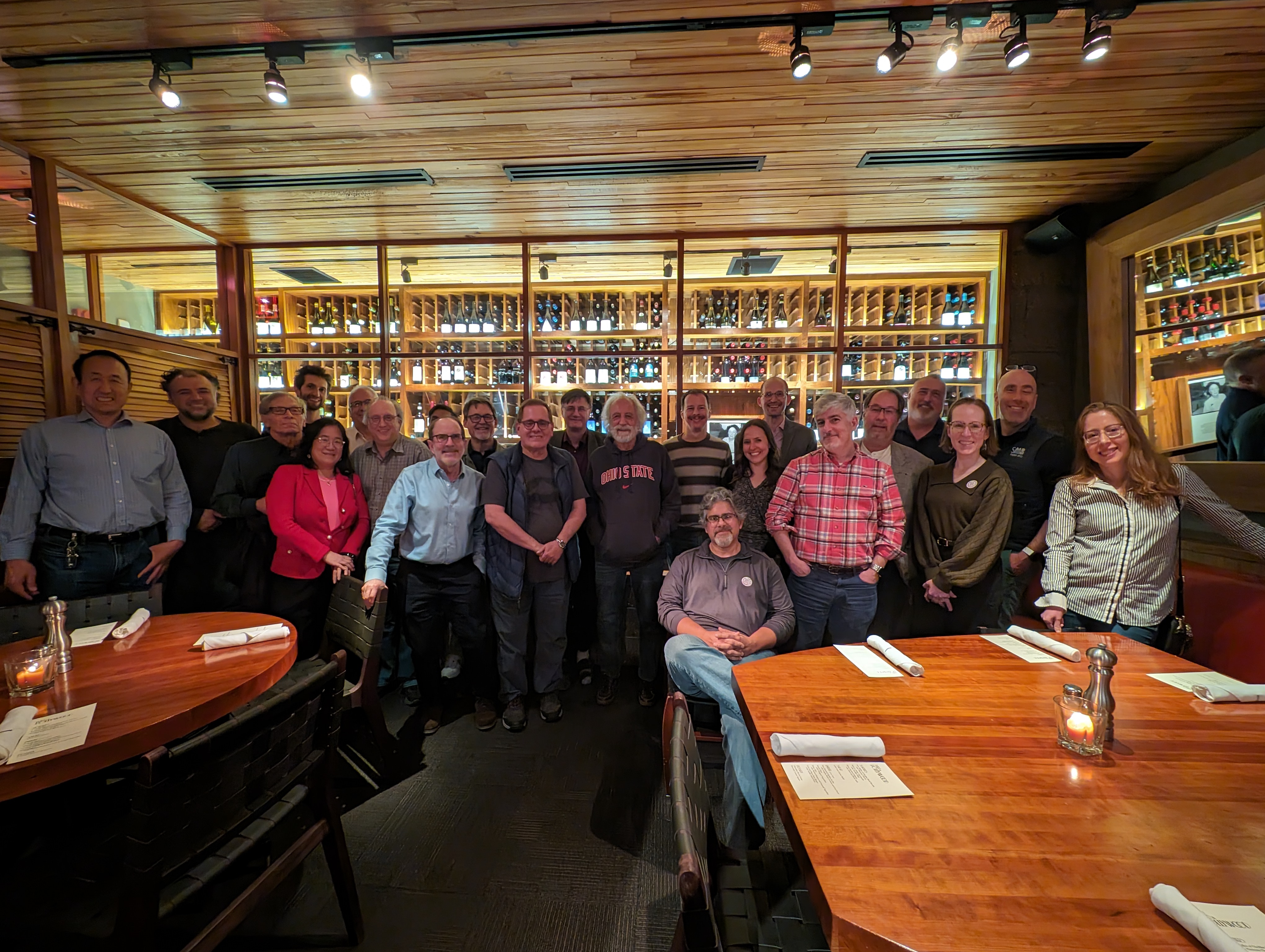 Group photo of Physics Faculty and Pierre Agostini at celebratory dinner at Third and Hollywood.