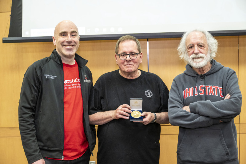 (left to right) Michael Poirier, Lou DiMauro, and Pierre Agostini posing with the Nobel medal replica.