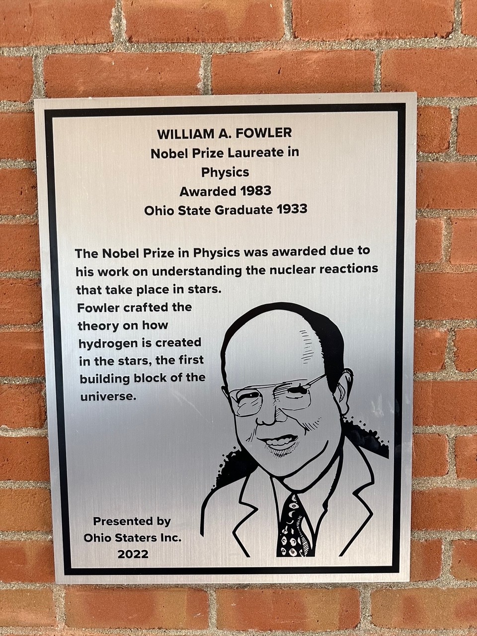 William Fowler's silver plaque on the wall of the 18th street library