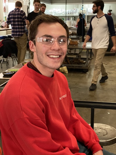 Brandon Manley smiling and wearing protective goggles