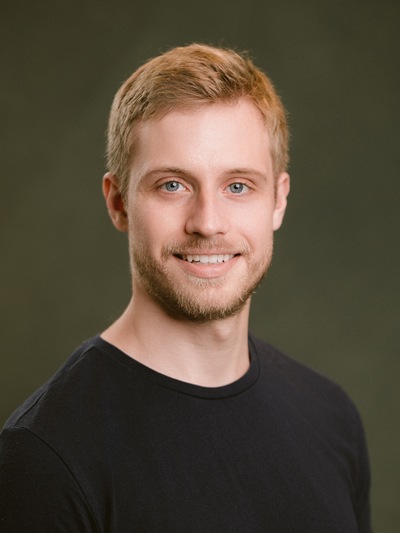 Erik's headshot on a grey background