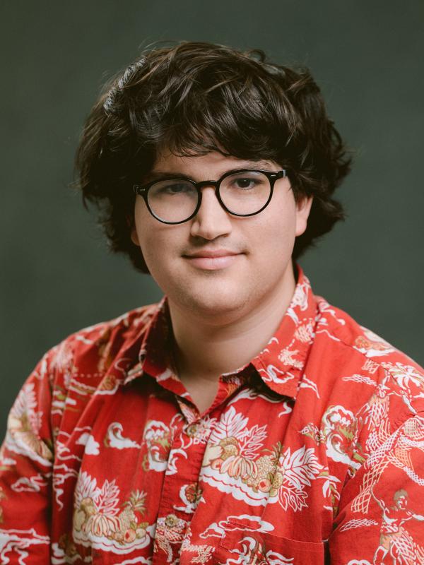 Charles' headshot on a grey background