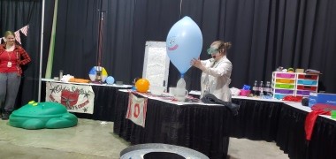 Christine Jackson blowing up a balloon