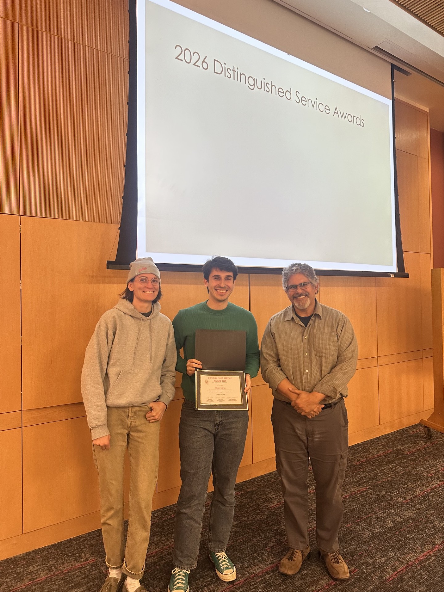 Alican receiving his award