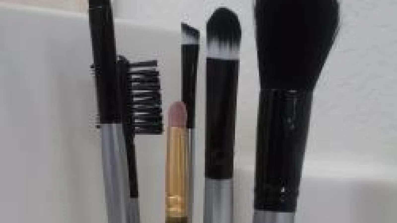 Various sized makeup brushes