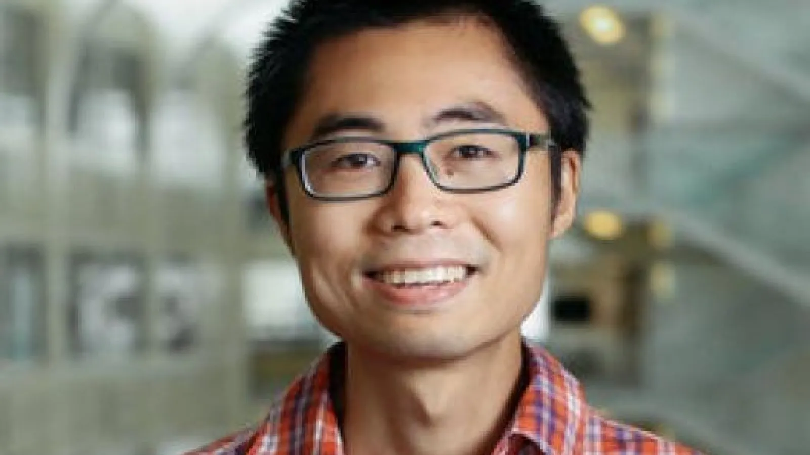 Yuanming Lu smiling in front of PRB Atrium