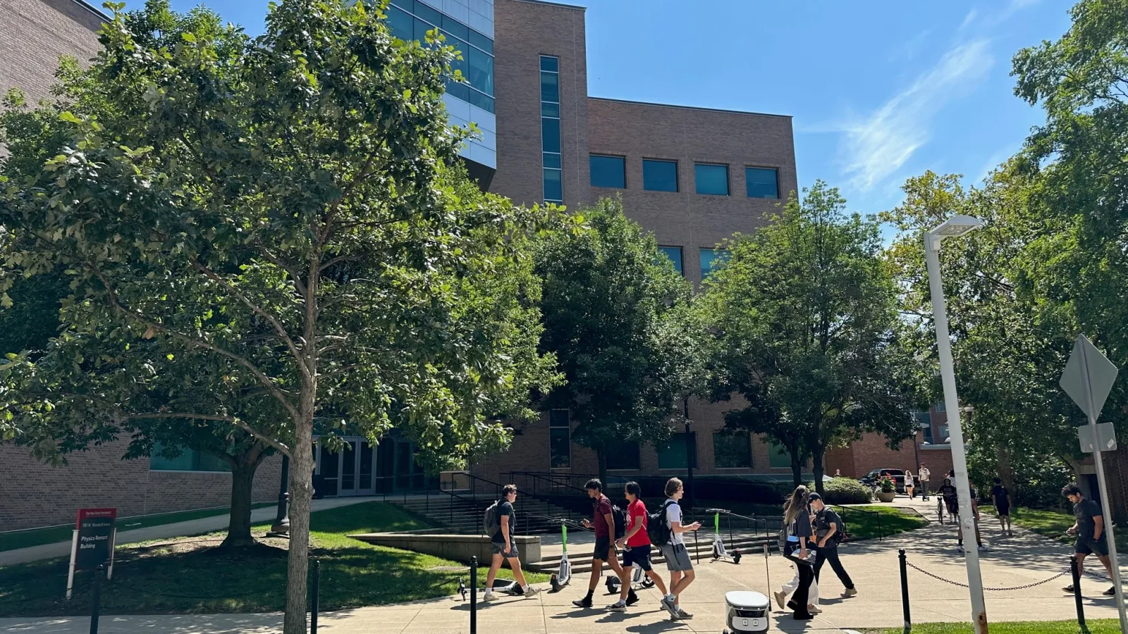Outside of PRB with students passing. Bright blue sky, sunny day.