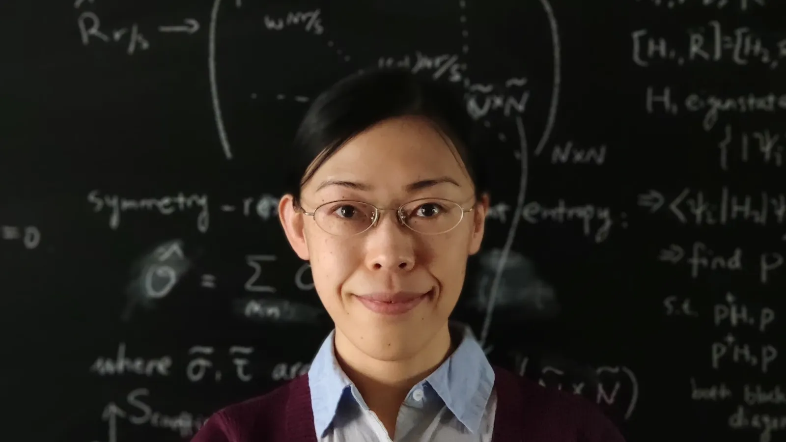 Laimei Nie in front of a chalkboard