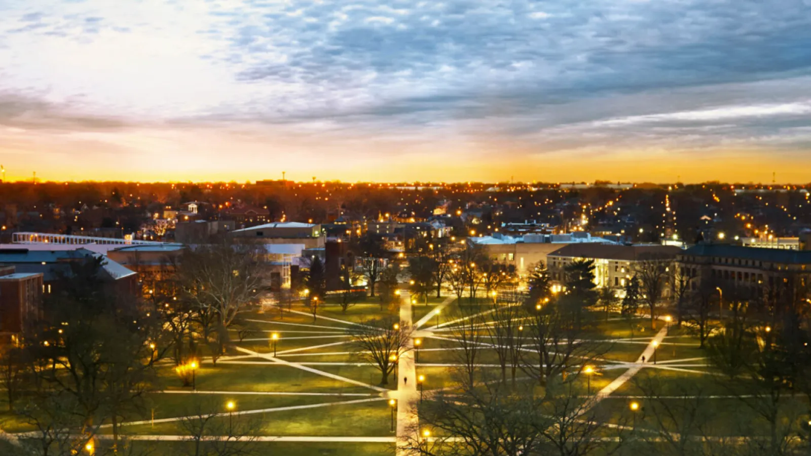Aerial photo of the oval and surrounding buildings at sunset