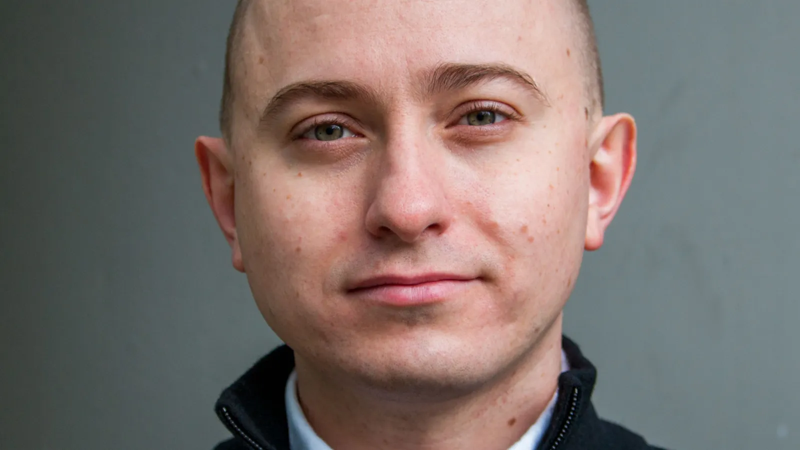 Headshot of Dmitry Ovchinnikov with grey background