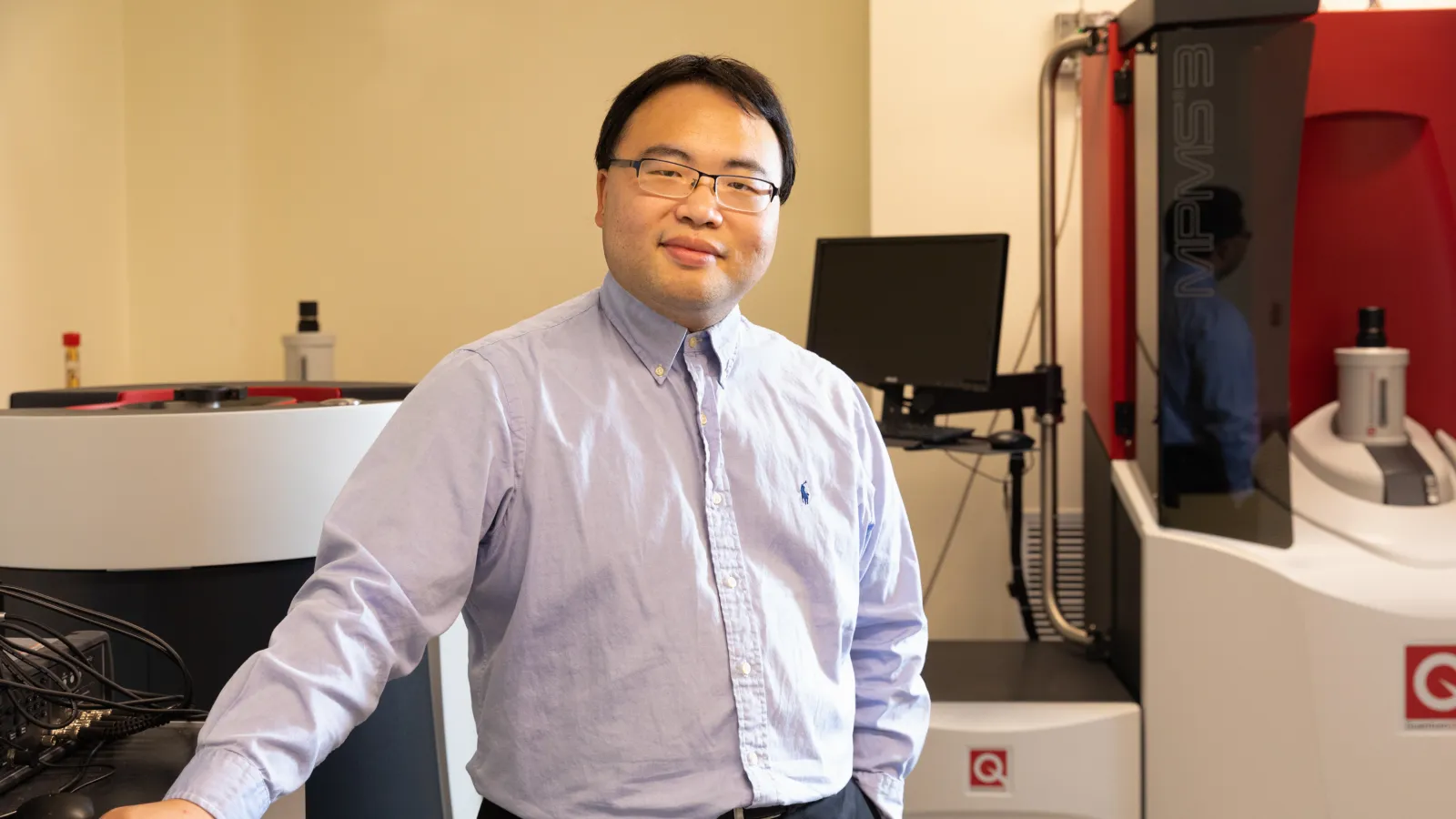 Jin Hu standing in a kitchen.