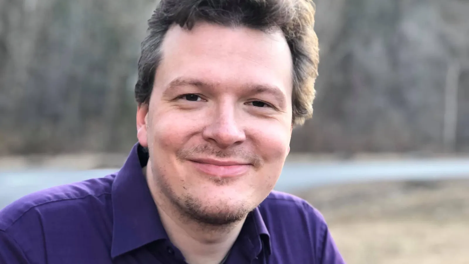 Matthew Szydagis with trees in the background