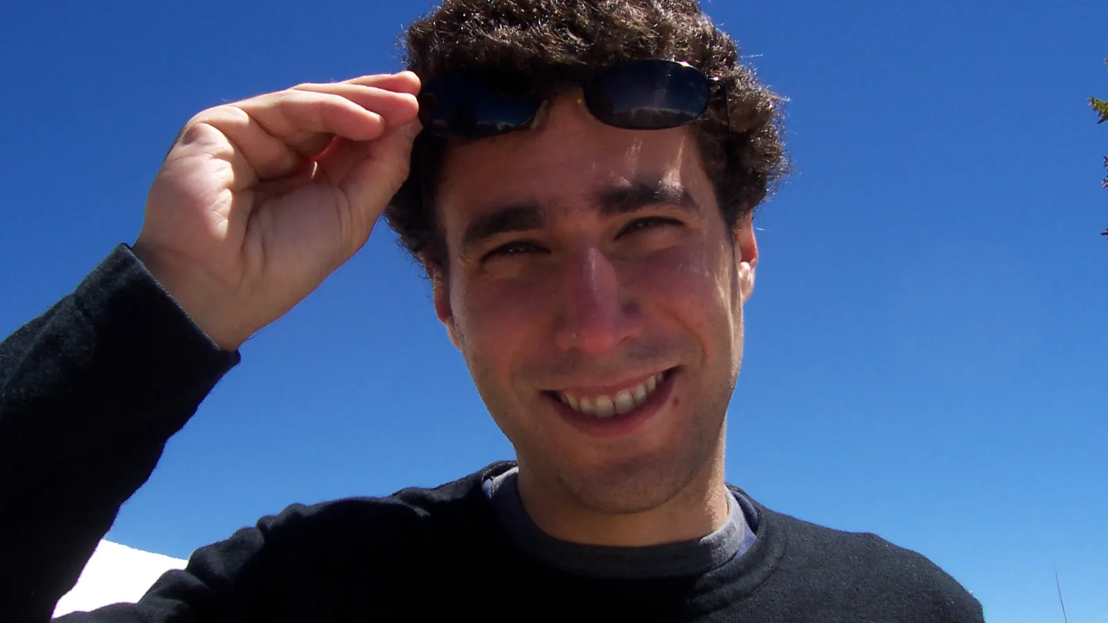 Gil with blue sky behind him
