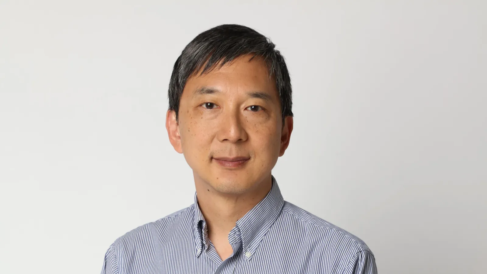 Kenneth Chang with plain white background