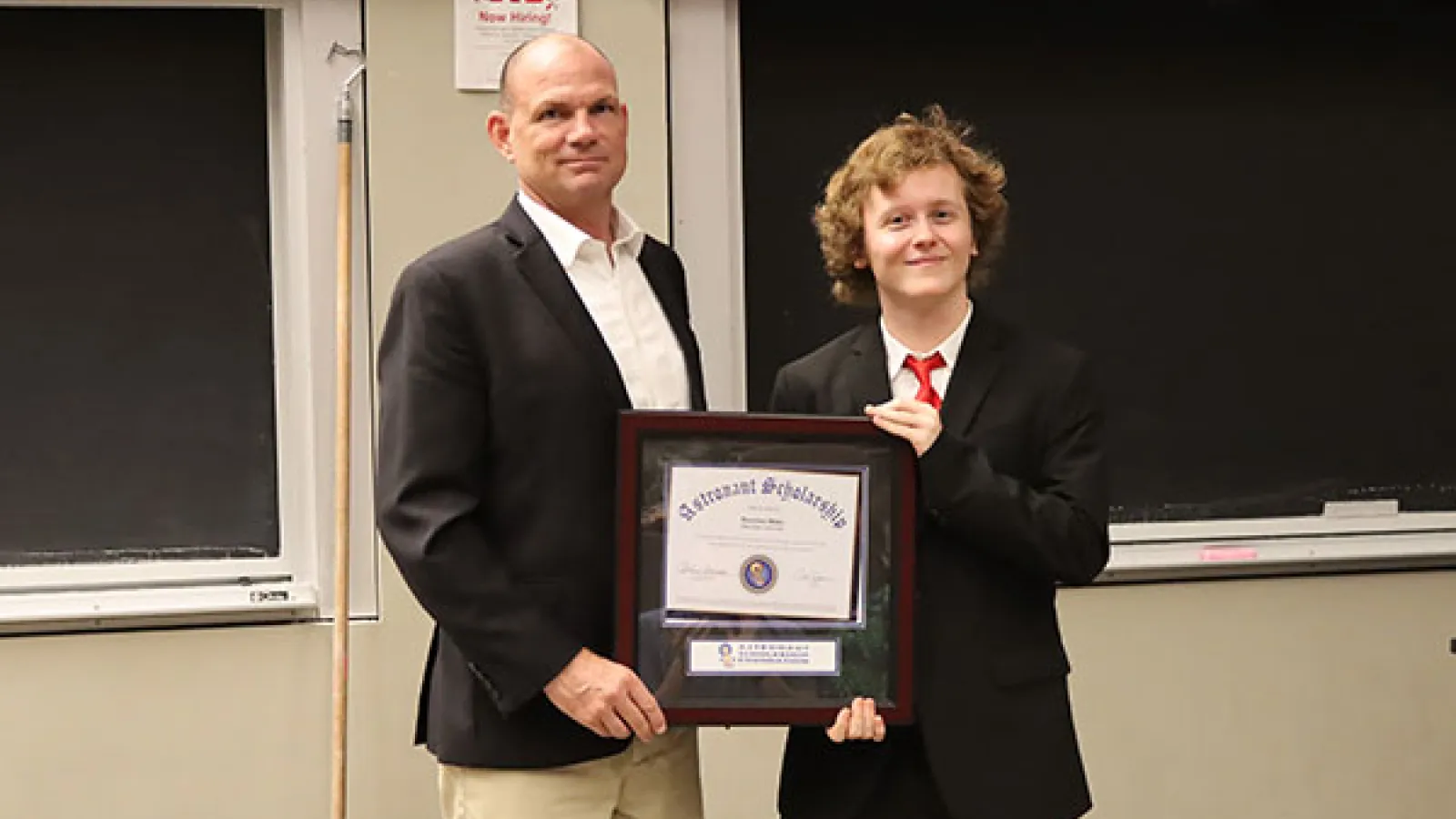 Harrison Blake receiving the award