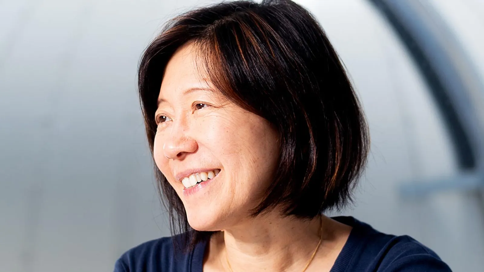 Chung-Pei smiling and looking off to the side