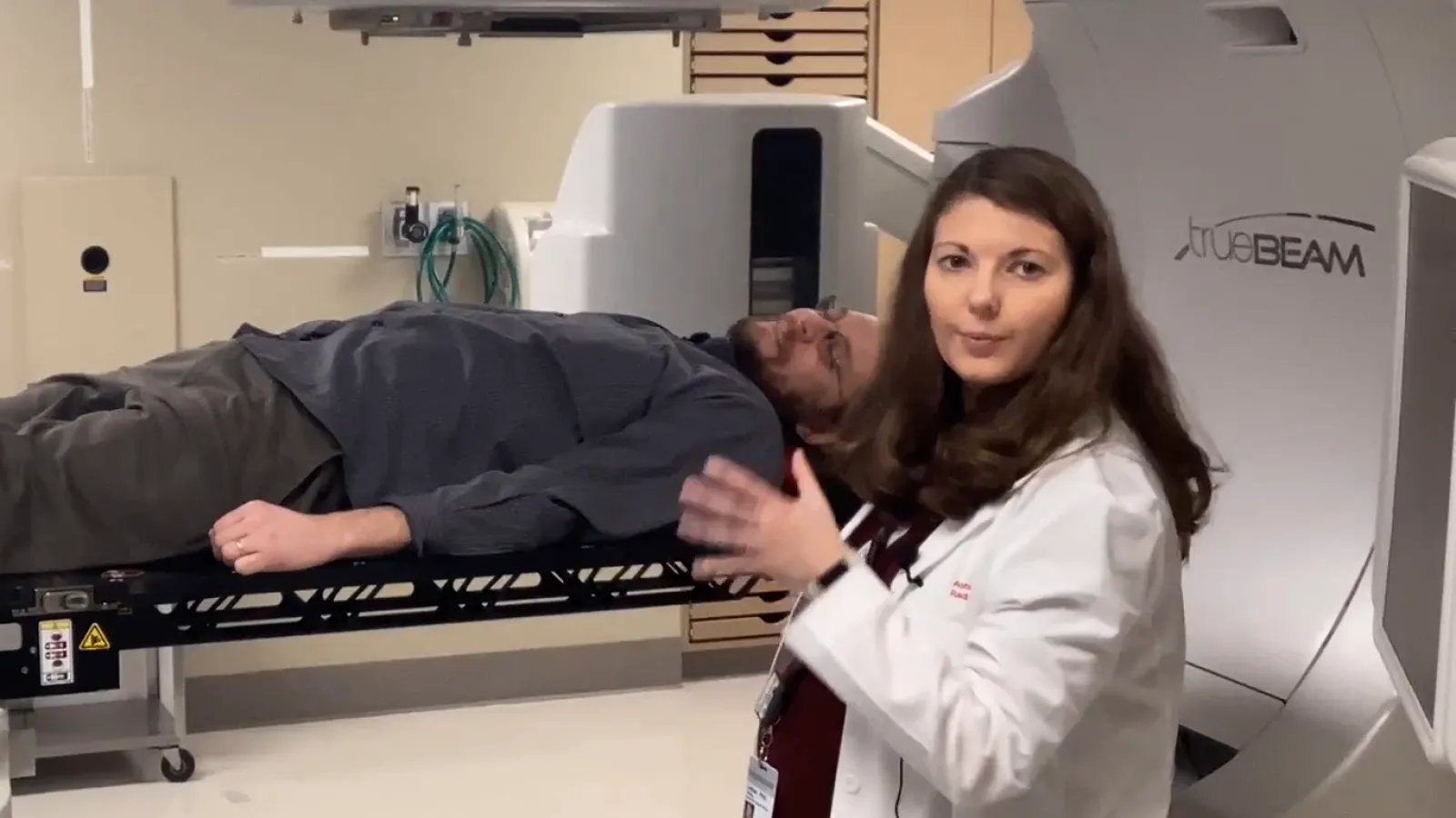 Chris Orban lying in an MRI machine as part of demonstration
