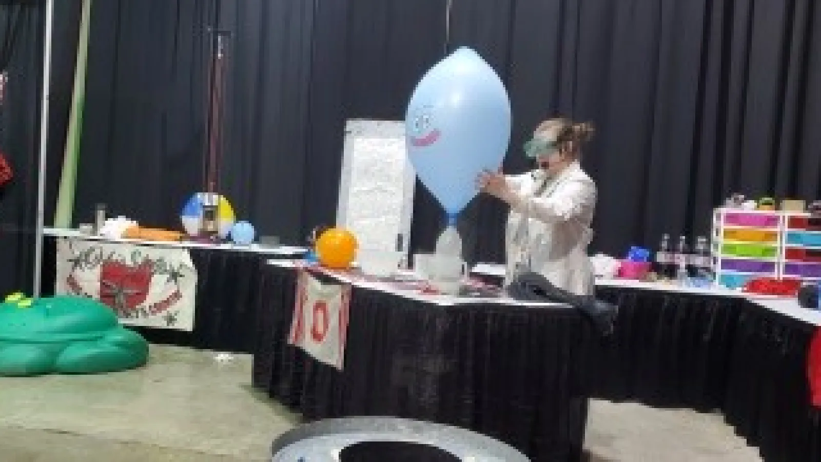 Christine Jackson blowing up a balloon