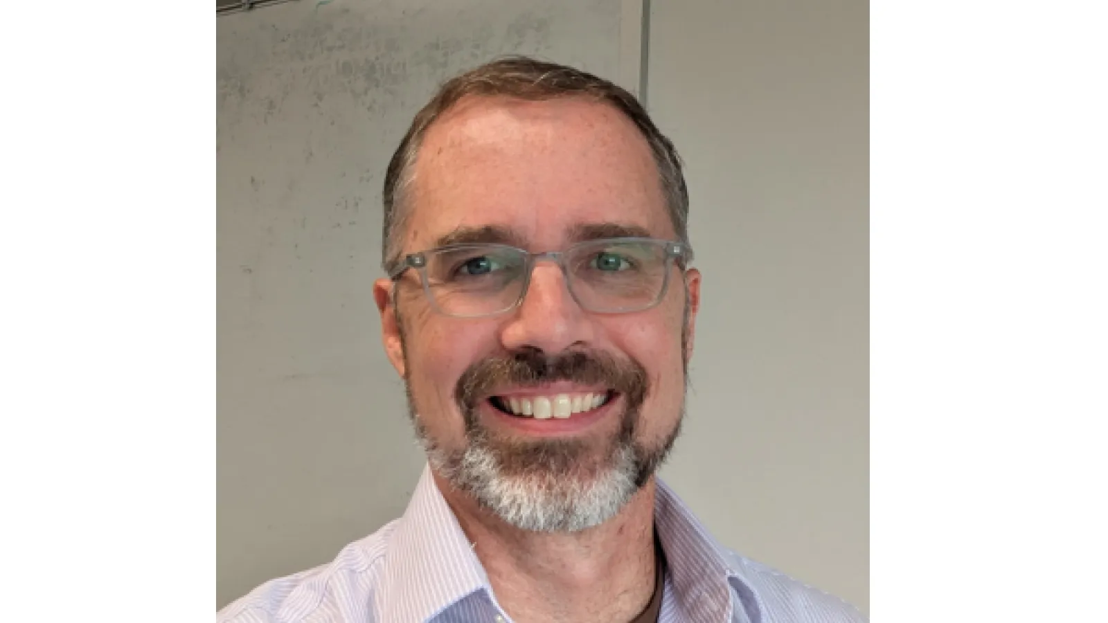 Paul M. Haney smiling