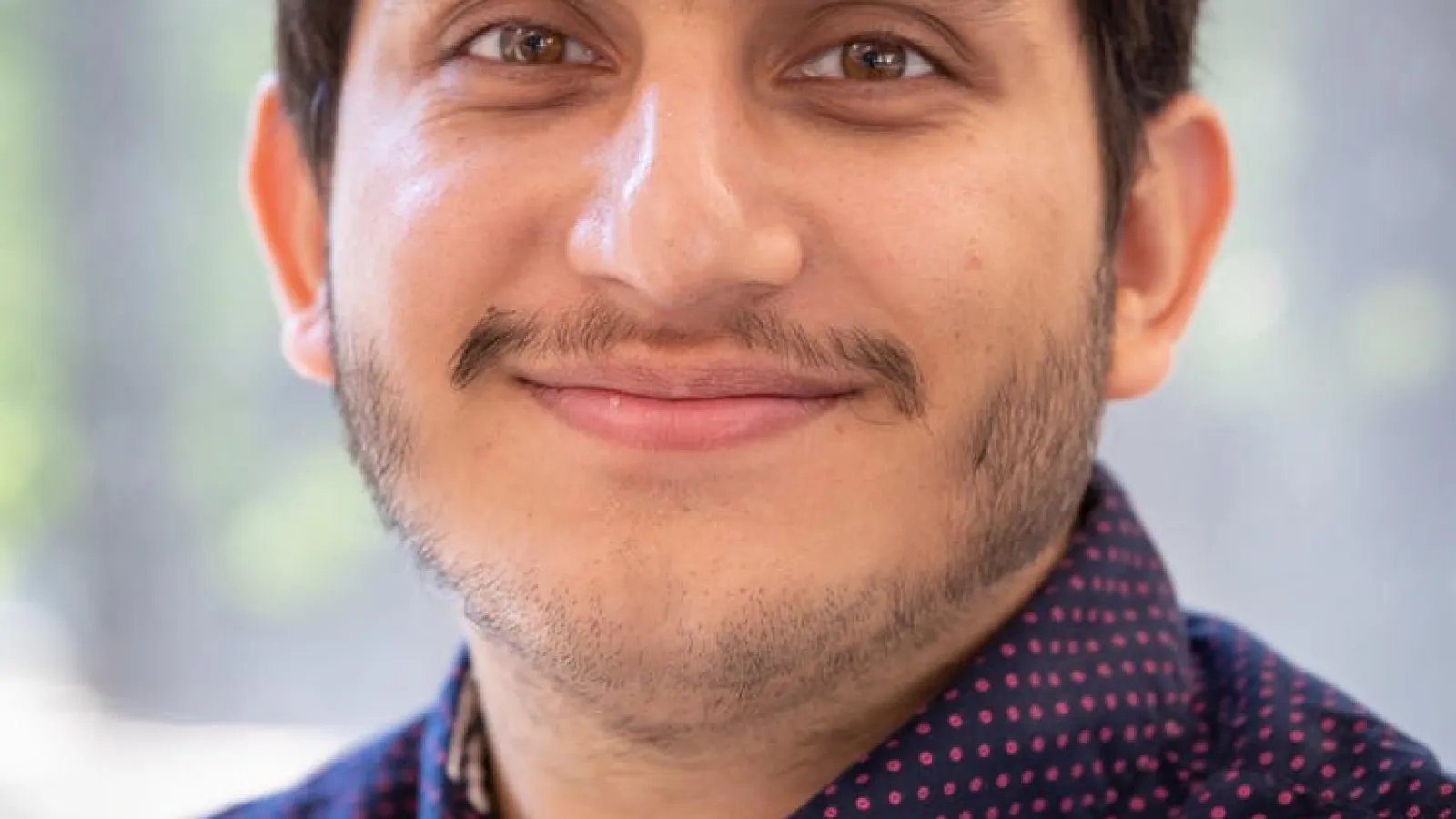 Headshot of Rhine Samajar.