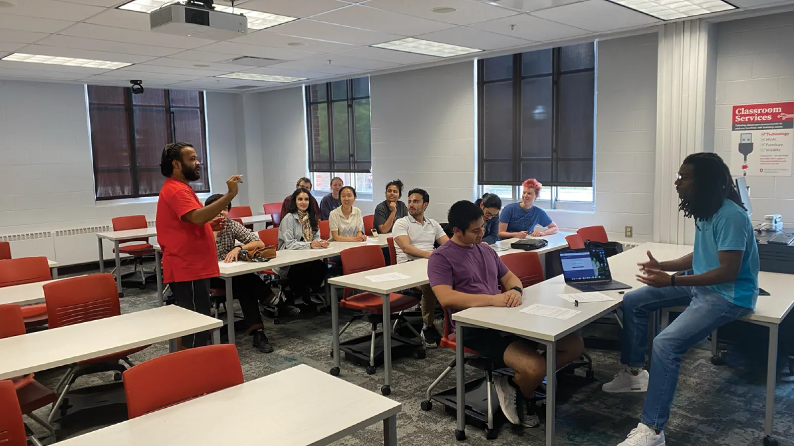 Graduate students discussing physics readiness.