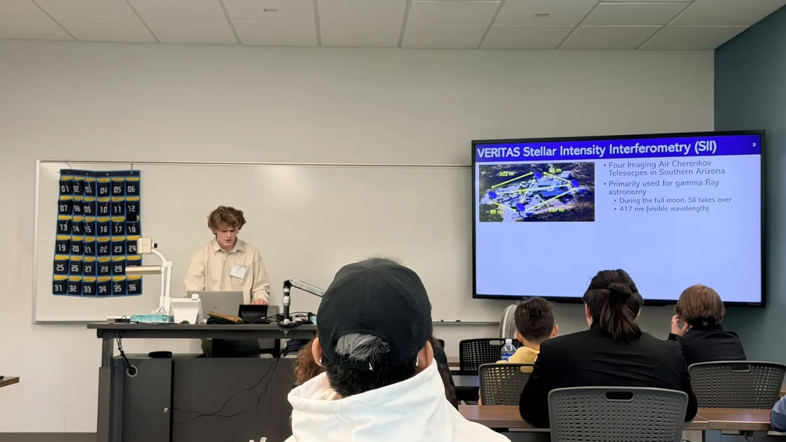 John Scott, undergraduate physics student, presenting his research.