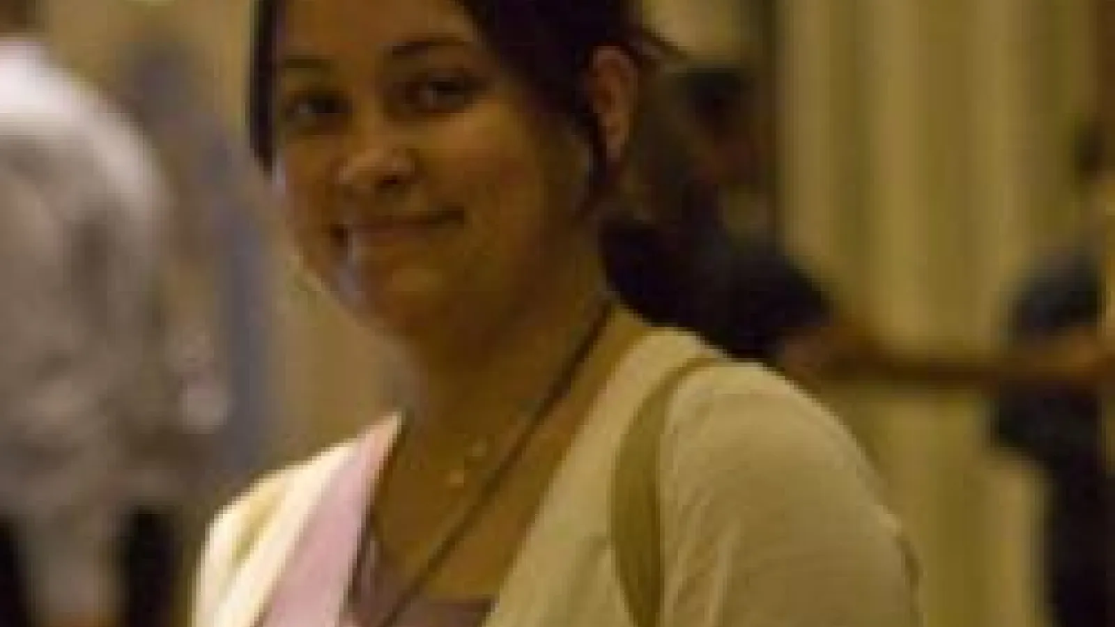 Shreyashi Chakdar smiling with blurred out hallway behind her