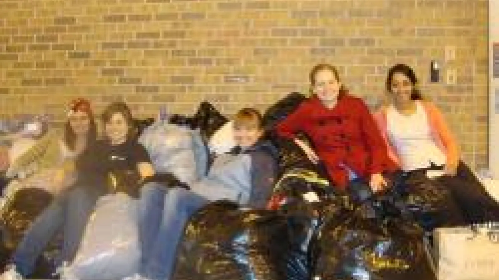 Members of Graduate Women in Physics at The Ohio State University with bags full of charity donations.