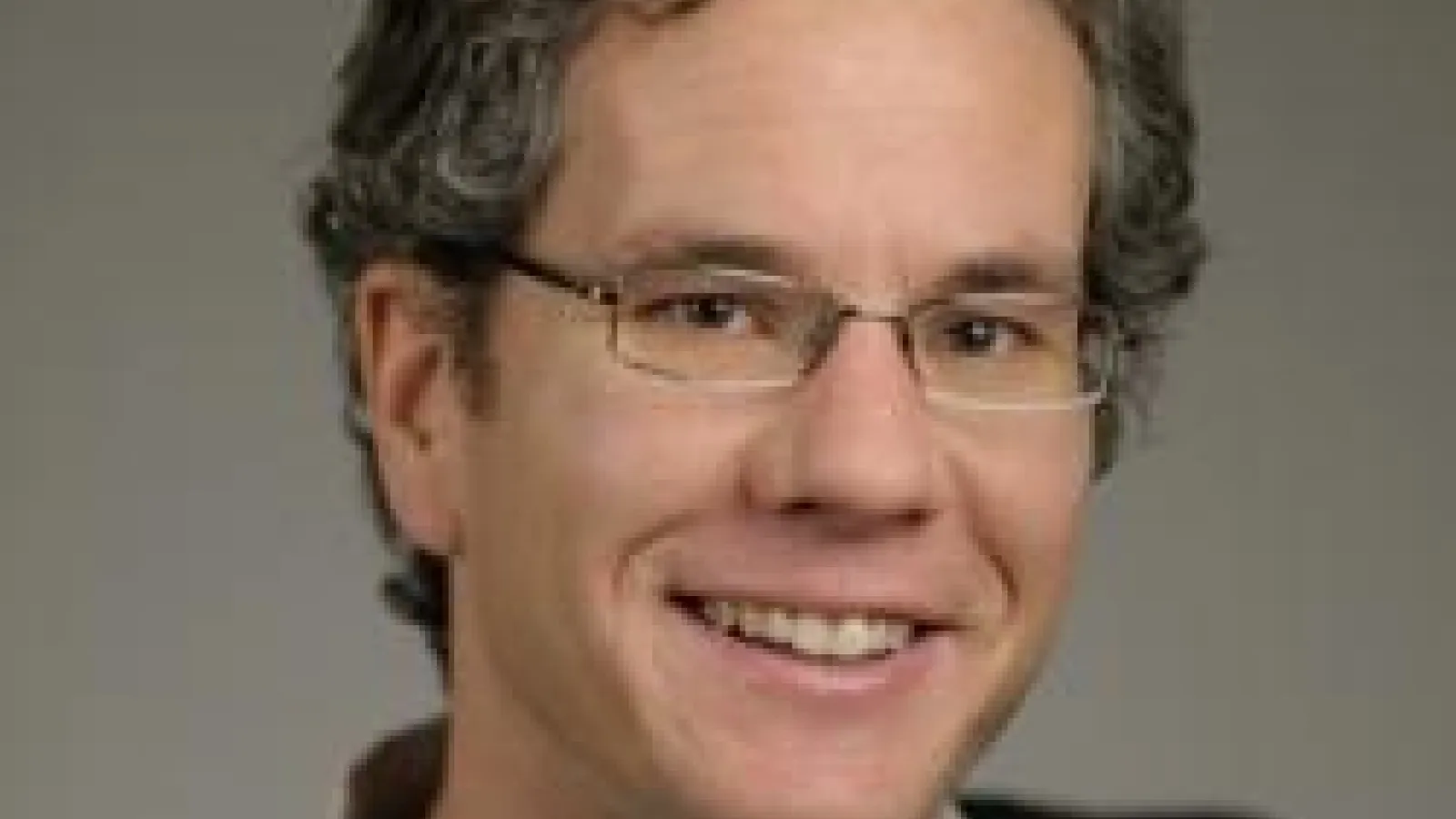 Dan Larson with beige background