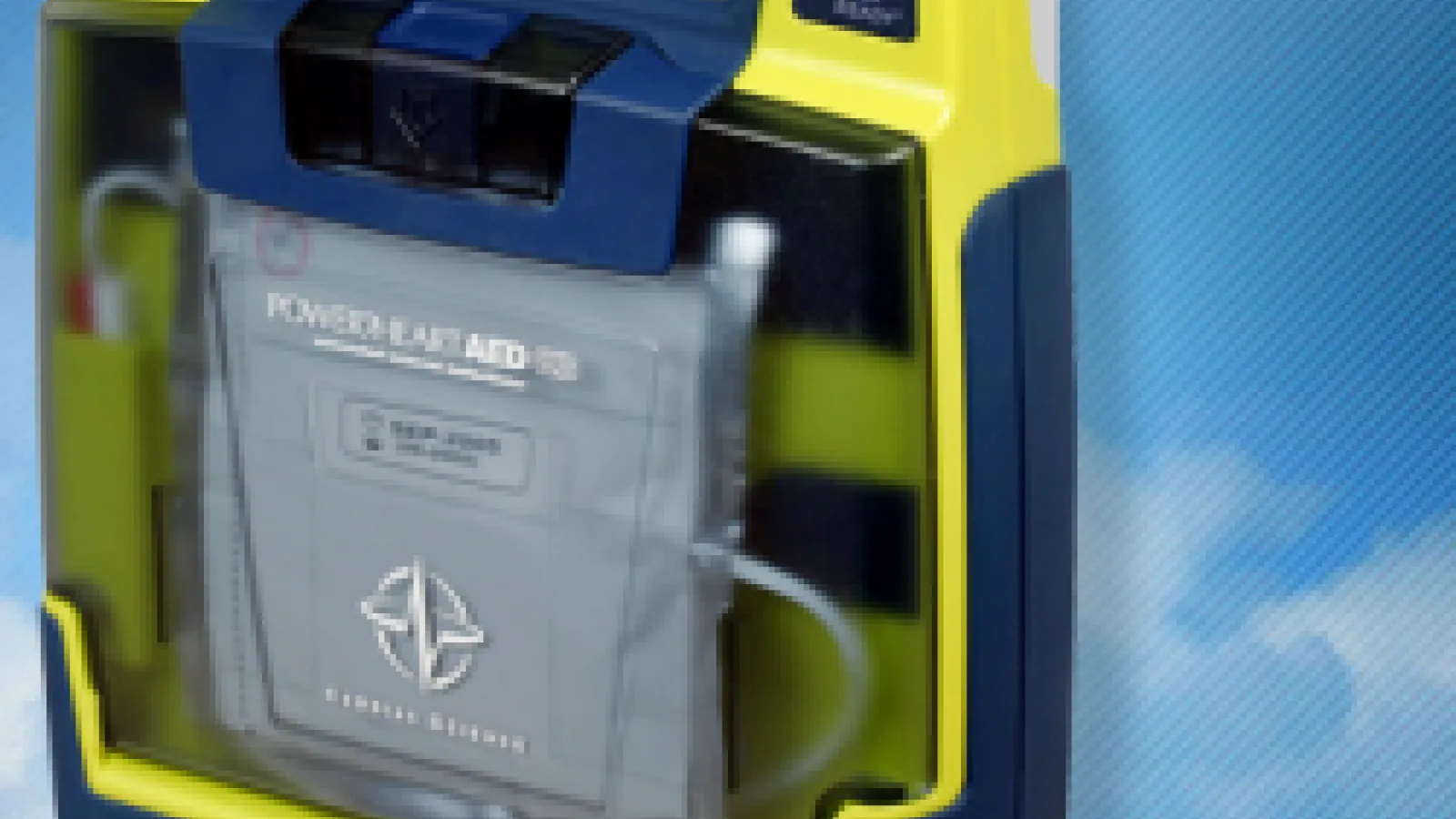 Clip art of yellow and blue AED with sky in the background