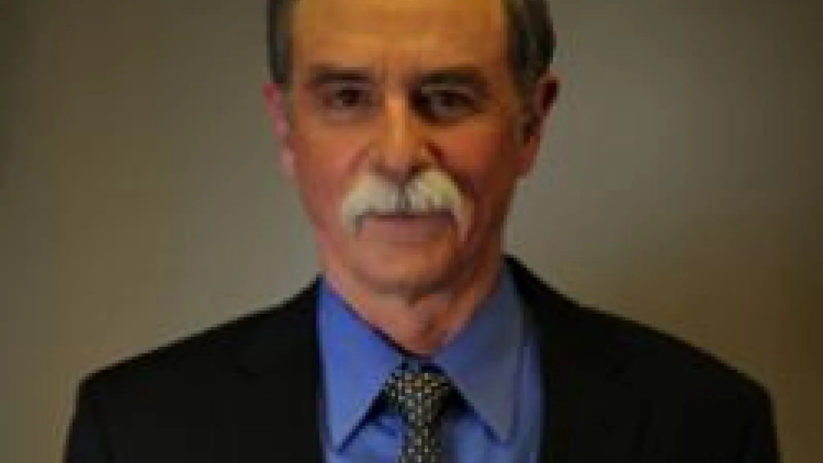 David Wineland with dark, brown background