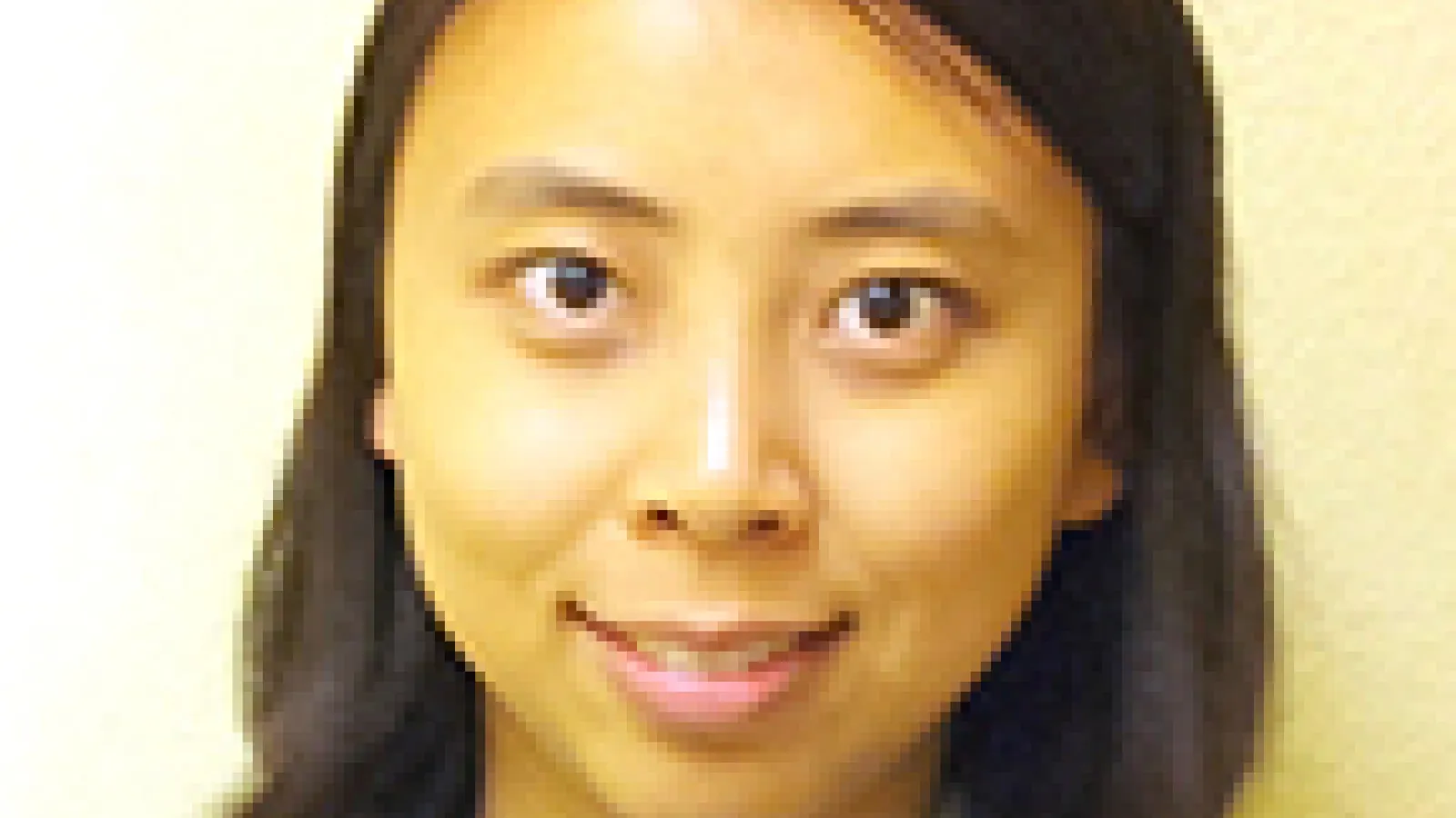 Yi Li with plain yellow background
