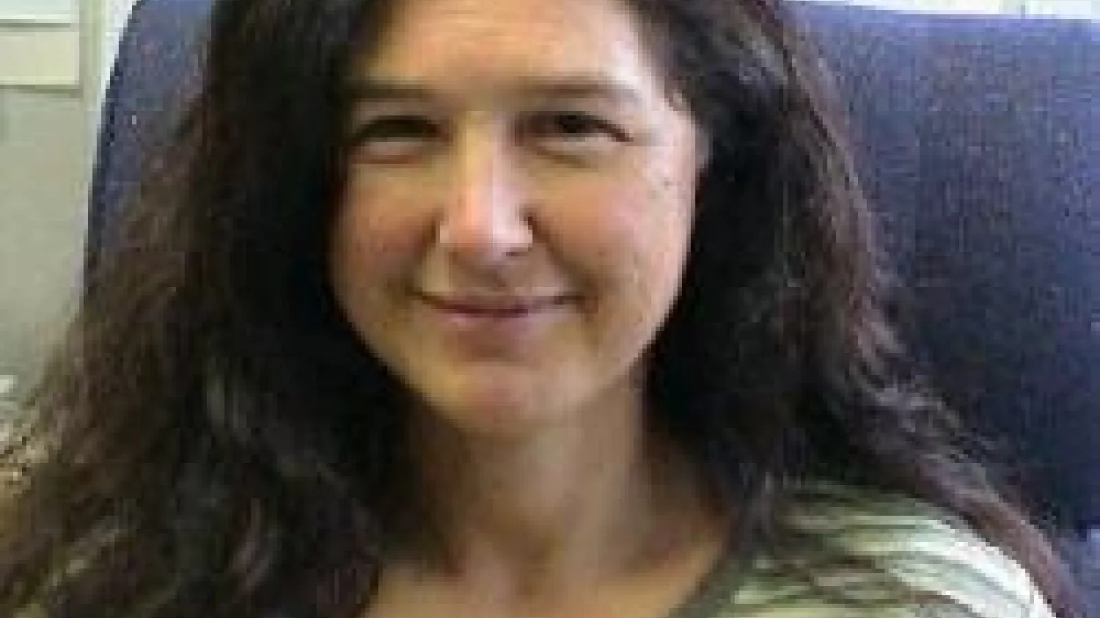 Adriana Moreo sitting in blue chair