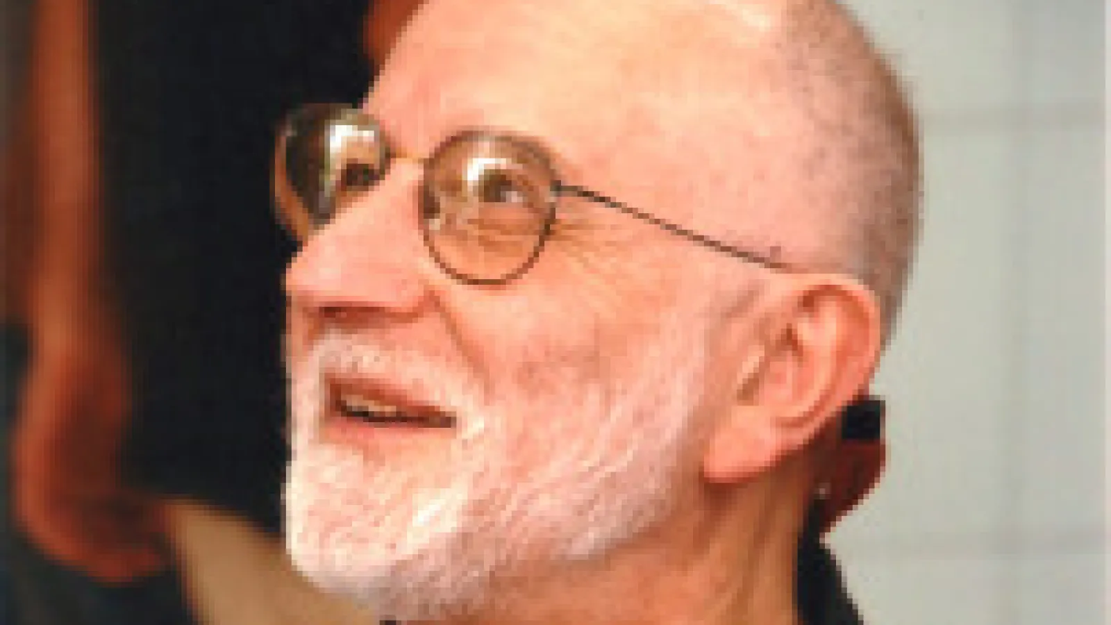 Sir Michael Victor Berry smiling and looking off to the side