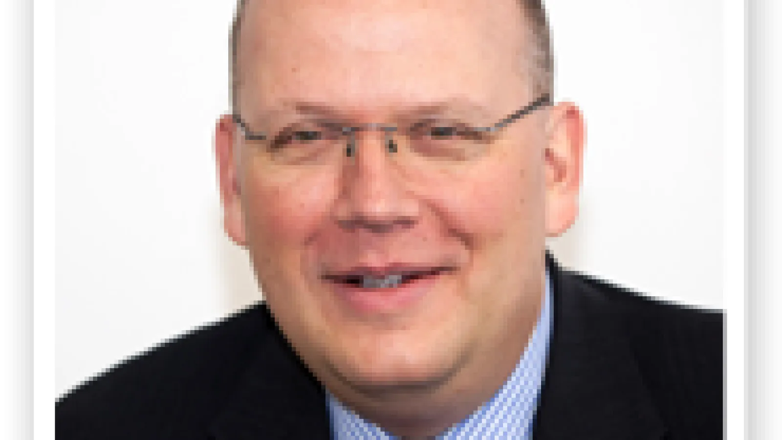 Headshot of  Damian Handzy