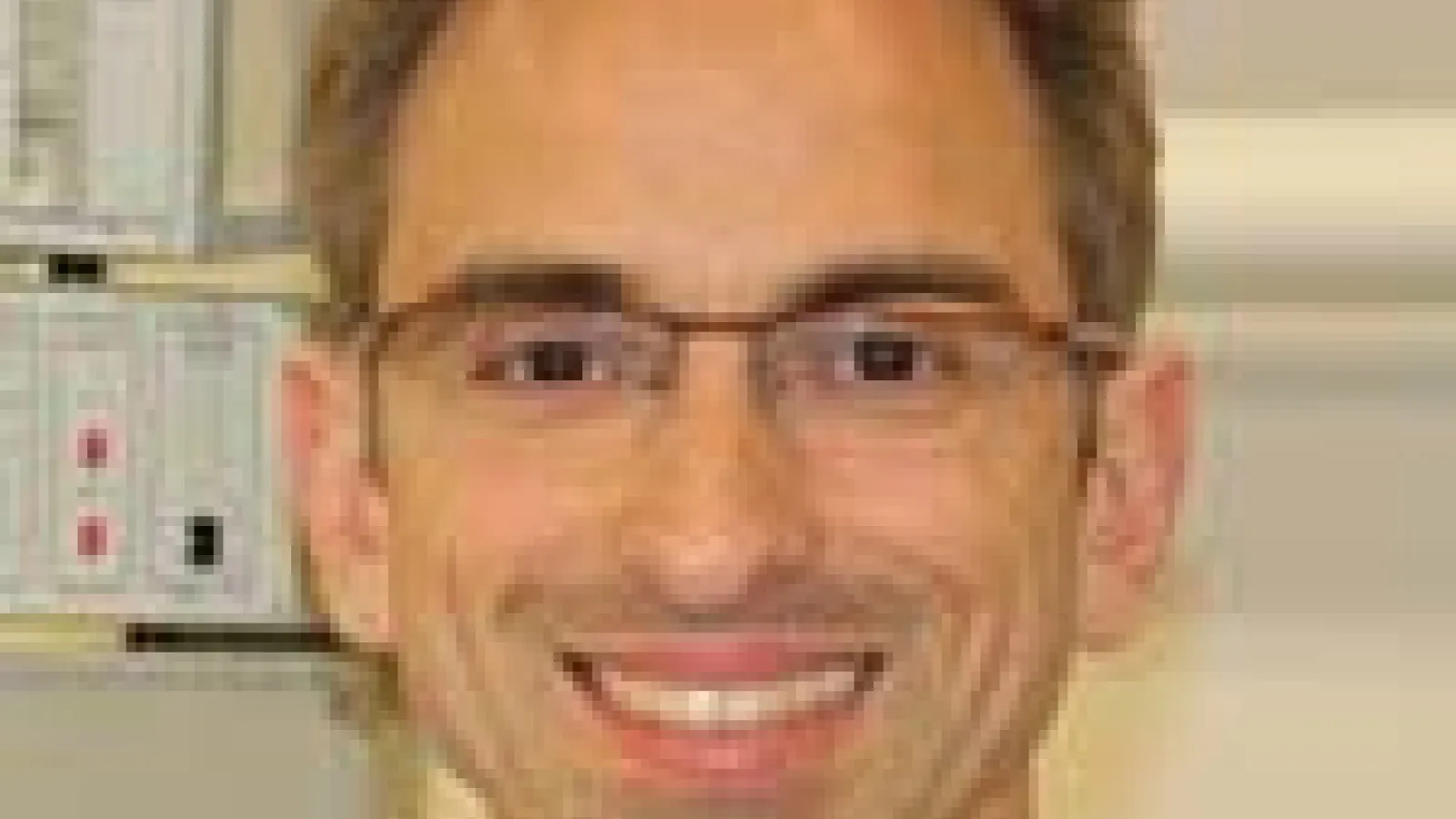 Dr. Stefan Stoll smiling close up