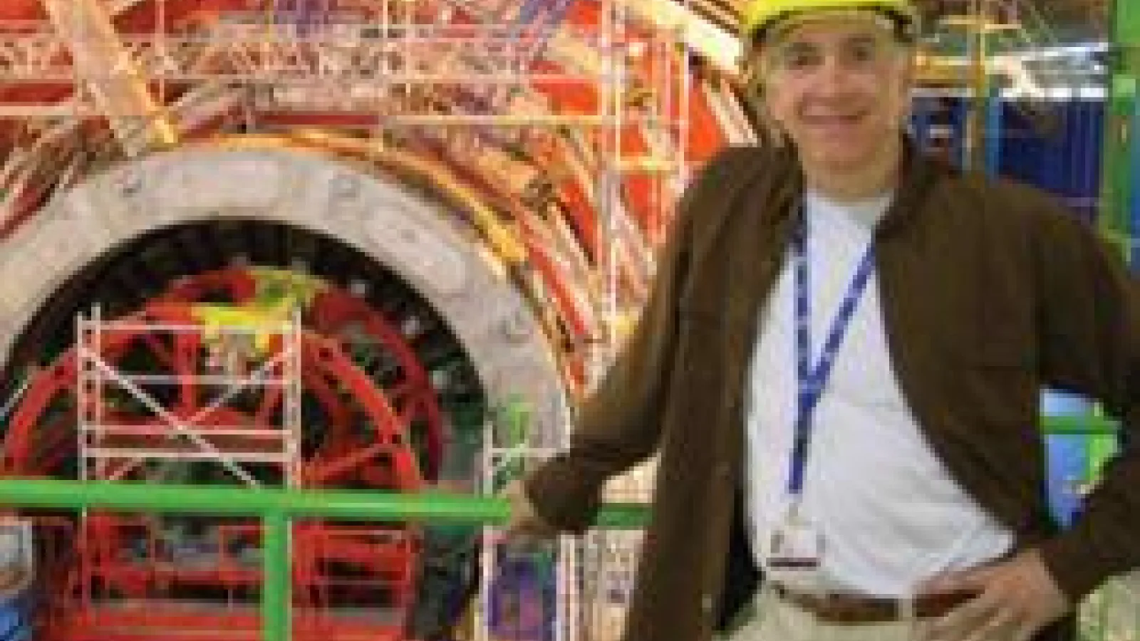 Joe Incandela standing in front of large CERN machinery