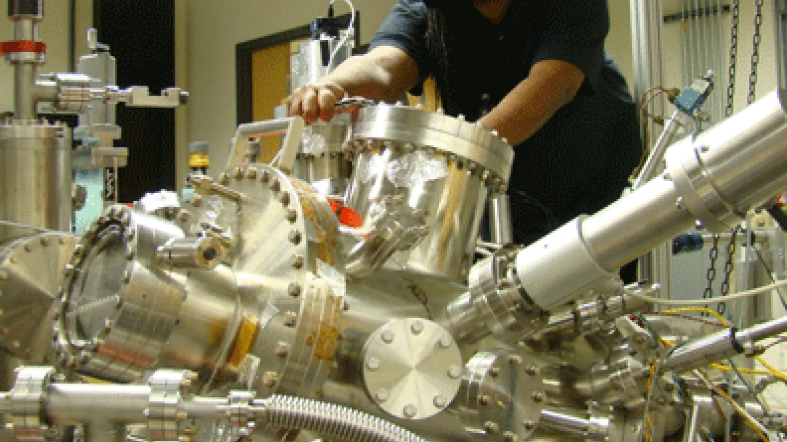 Njoki Mwangi working on machinery in the lab