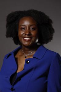 Geraldine Cochran smiling with grey background