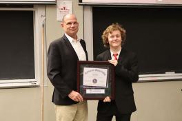 Harrison Blake receiving the award