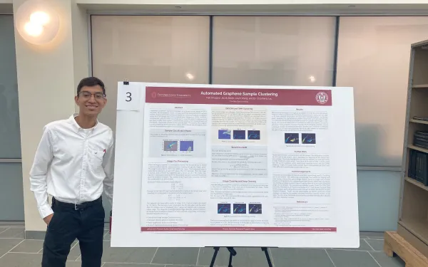 Neil Ghugare with poster of his research