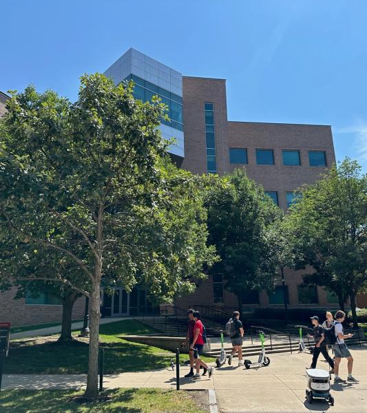 Outside of the PRB with sun shining and students walking past.