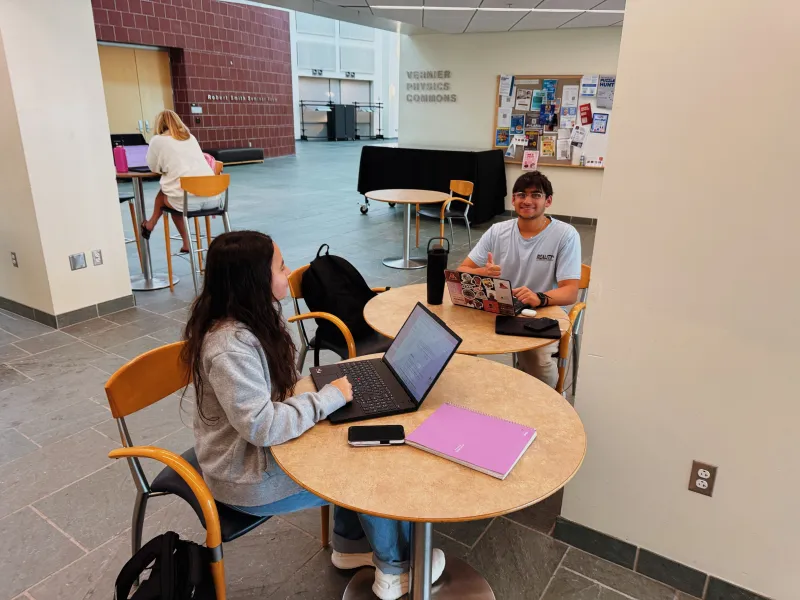 two students at a table working