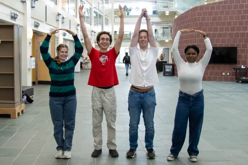 students doing O-H-I-O pose