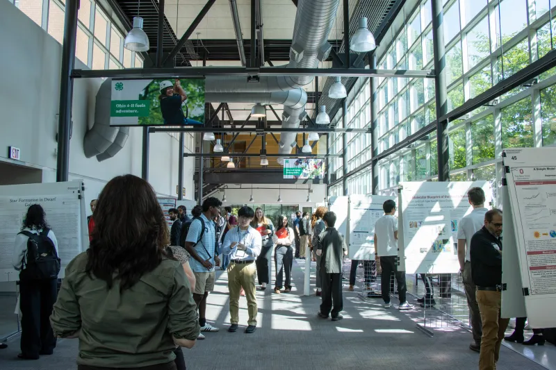 group of students and people at poster session